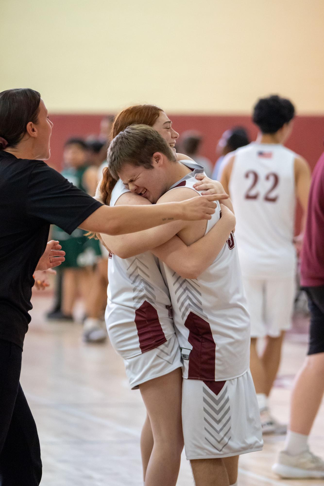 Teammates Molly Larkin and Patrick Samson during their home game. 