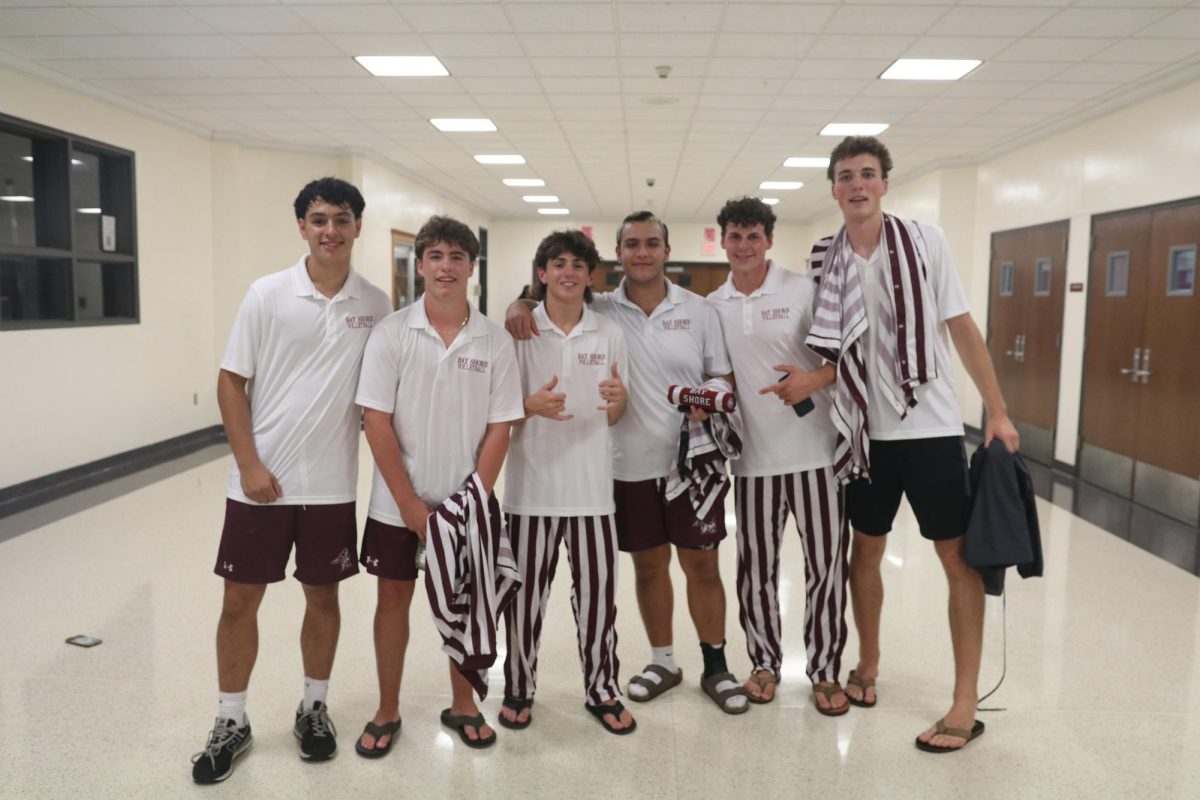 Boys Volleyball gather together after willing the Spirit Stick at the Pep Rally. 